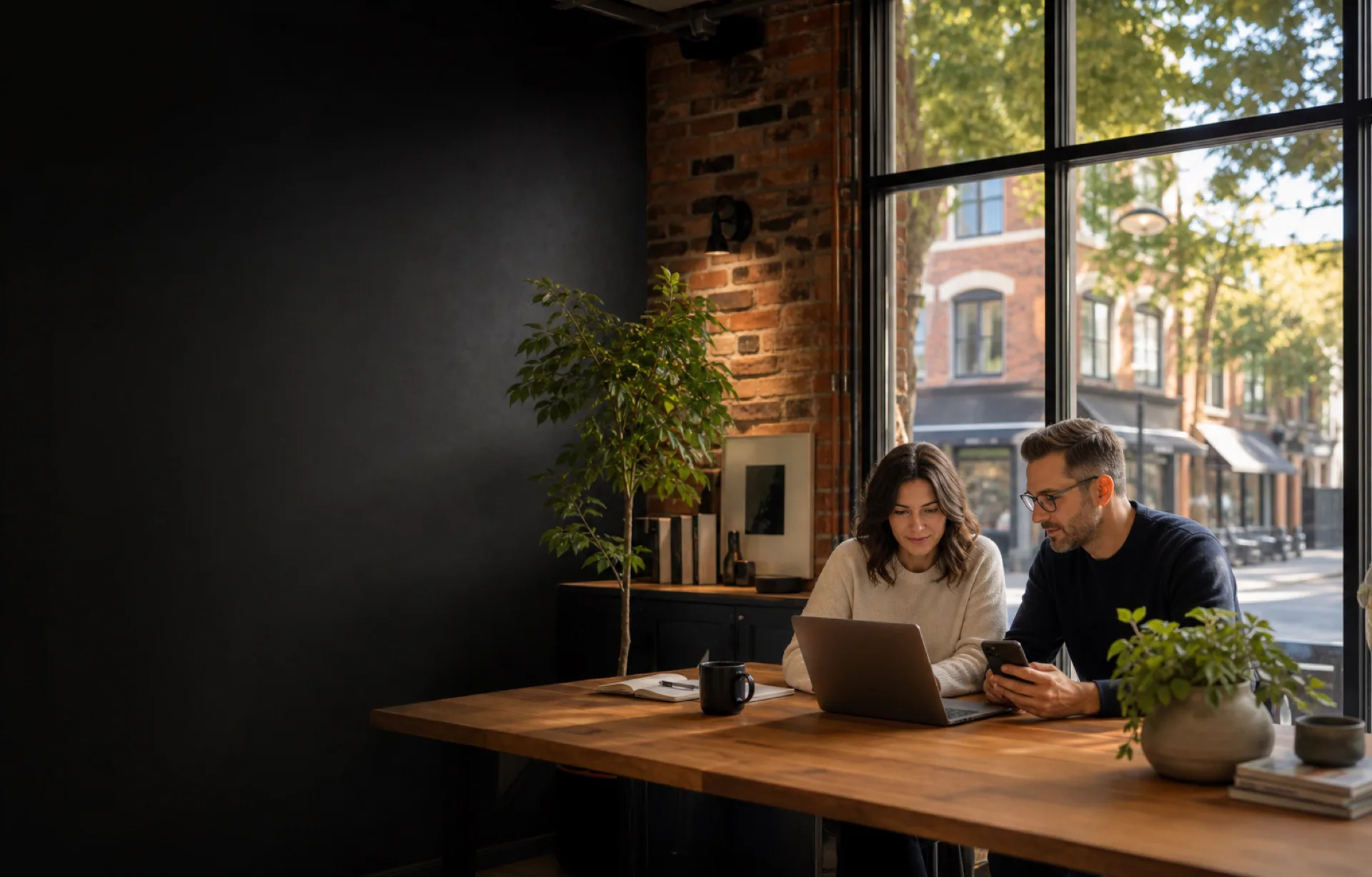 Southern Ontario business owners reviewing their website in a polished local workspace